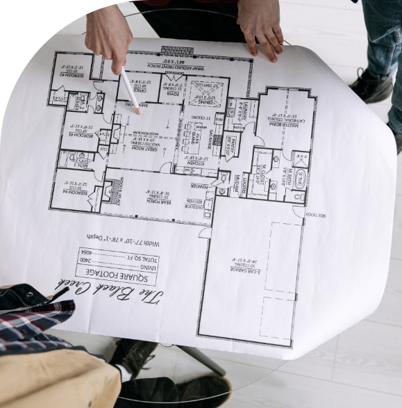 people looking at blueprints